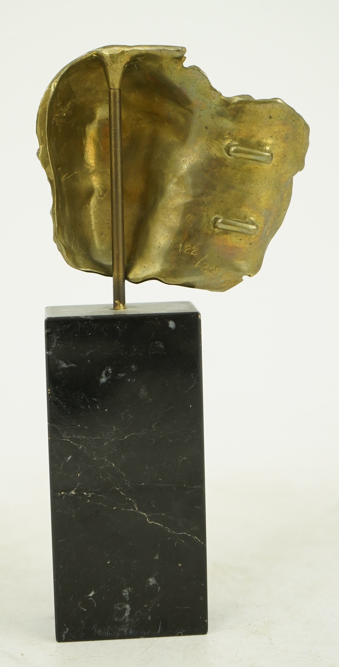 Igor Mitoraj (Polish, 1944-2014), Visage Envolé, bronze and black marble, 16.5 x 7 x 2.5cm